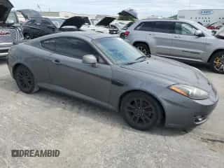 2007 Hyundai Tiburon GS с VIN KMHHM66D47U243846, выставлен на аукционе Copart как лот 57509725 с пробегом 181 941 миль миль и Списание • Salvage title. История ставок и продаж доступна на DreamBid. Изображение 4.