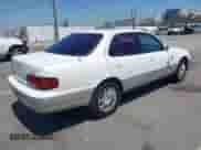 1996 Toyota Camry LE z VIN JT2BF12K9T0172942, wystawiony jako IAAI lot #43023485 z przebiegiem 294 899 mil mil oraz . Historia ofert i sprzedaży dostępna na DreamBid. Obrazek 4.