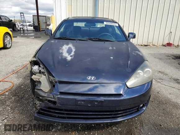 2008 Hyundai Tiburon GS z VIN KMHHM66D18U295484, wystawiony jako Copart lot #46948045 z przebiegiem 107 959 mil mil oraz Szkoda całkowita • Salvage title. Historia ofert i sprzedaży dostępna na DreamBid. Obrazek 5.