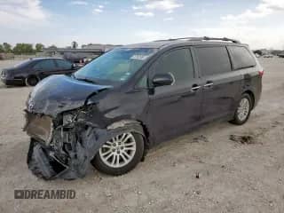 2015 Toyota Sienna XLE with VIN 5TDYK3DC1FS549649, listed as a Copart auction lot 70762555 with 106,883 mi miles and Salvage title. Bid and sale history available at DreamBid. Image 1.