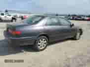 2000 Toyota Camry LE z VIN JT2BG22K8Y0403310, wystawiony jako Copart lot #81339785 z przebiegiem 222 724 mil mil oraz Szkoda całkowita • Salvage title. Historia ofert i sprzedaży dostępna na DreamBid. Obrazek 3.