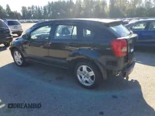 2009 Dodge Caliber SXT with VIN 1B3HB48A39D130816, listed as a Copart auction lot 82270345 with 106,380 mi miles and Salvage title. Bid and sale history available at DreamBid. Image 2.