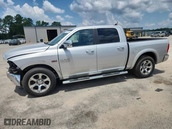 2014 Ram 1500 Laramie with VIN 1C6RR6NT0ES397960, listed as a Copart auction lot 61458895 with 148,298 mi miles and Salvage title. Bid and sale history available at DreamBid. Image 1.