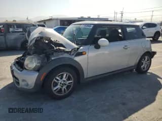 2011 MINI Hardtop with VIN WMWSU3C56BT097936, listed as a Copart auction lot 61863945 with 135,514 mi miles and Salvage title. Bid and sale history available at DreamBid. Image 1.