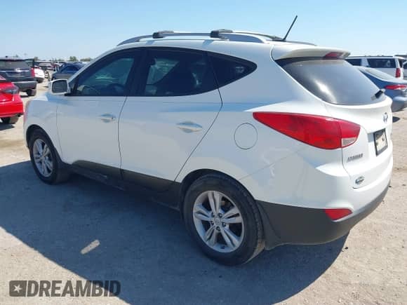 2013 Hyundai Tucson GLS z VIN KM8JU3AC0DU595316, wystawiony jako IAAI lot #43407036 z przebiegiem 184 884 mil mil oraz . Historia ofert i sprzedaży dostępna na DreamBid. Obrazek 3.