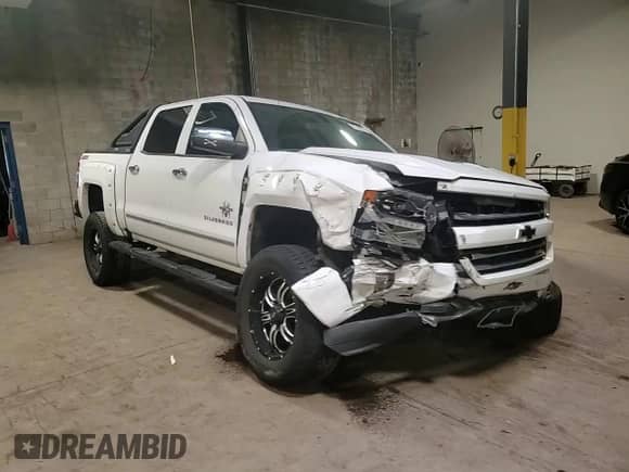 2017 Chevrolet Silverado 1500 LTZ z VIN 3GCUKSEJ6HG169441, wystawiony jako Copart lot #61245275 z przebiegiem 56 906 mil mil oraz Szkoda całkowita • Salvage title. Historia ofert i sprzedaży dostępna na DreamBid. Obrazek 13.