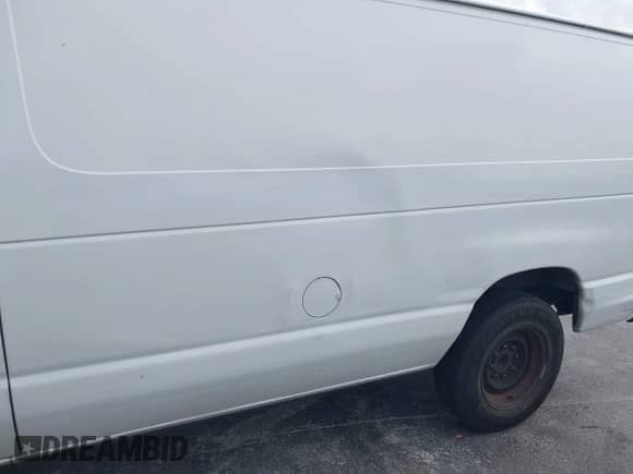 2013 Ford Econoline Cargo Commercial with VIN 1FTNE1EW1DDA90039, listed as a IAAI auction lot 42439049 with 218,937 mi miles and . Bid and sale history available at DreamBid. Image 6.