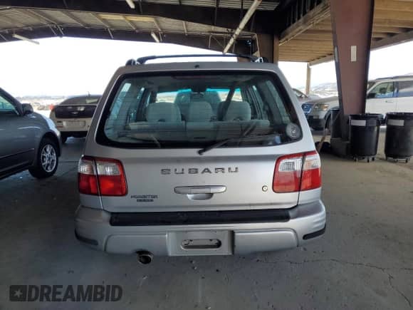 2002 Subaru Forester S with VIN JF1SF65602H712543, listed as a Copart auction lot 67325015 with 214,238 mi miles and Salvage title. Bid and sale history available at DreamBid. Image 6.