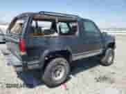 1998 Chevrolet Tahoe with VIN 3GNEK18R0WG112642, listed as a Copart auction lot 64304765 with 194,247 mi miles and Salvage title. Bid and sale history available at DreamBid. Image 3.