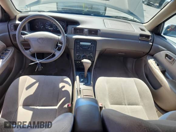 2000 Toyota Camry LE z VIN JT2BG22K7Y0467127, wystawiony jako Copart lot #84280225 z przebiegiem 118 606 mil mil oraz Szkoda całkowita • Salvage title. Historia ofert i sprzedaży dostępna na DreamBid. Obrazek 8.