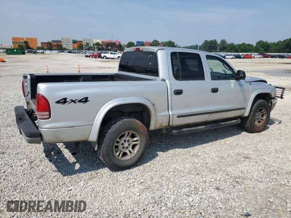 2003 Dodge Dakota SLT z VIN 1D7HG48N73S127509, wystawiony jako Copart lot #65515595 z przebiegiem 161 928 mil mil oraz Szkoda całkowita • Salvage title. Historia ofert i sprzedaży dostępna na DreamBid. Obrazek 3.