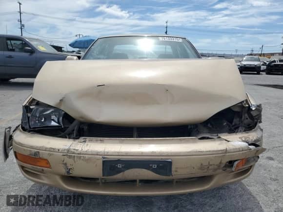 1996 Toyota Camry DX z VIN JT2BG12K5T0407026, wystawiony jako Copart lot #70133315 z przebiegiem 235 855 mil mil oraz Szkoda całkowita • Salvage title. Historia ofert i sprzedaży dostępna na DreamBid. Obrazek 5.