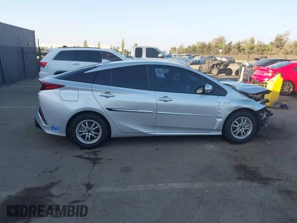 2021 Toyota Prius LE with VIN JTDKAMFP9M3166300, listed as a IAAI auction lot 43400137 with 64,301 mi miles and . Bid and sale history available at DreamBid. Image 13.
