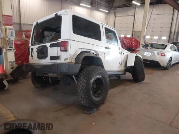 2012 Jeep Wrangler Arctic with VIN 1C4AJWBG9CL233232, listed as a IAAI auction lot 42282805 with 109,927 mi miles and . Bid and sale history available at DreamBid. Image 4.