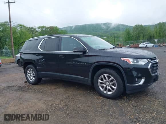 2018 Chevrolet Traverse LT Cloth z VIN 1GNEVGKW0JJ275663, wystawiony jako IAAI lot #42224038 z przebiegiem 115 995 mil mil oraz . Historia ofert i sprzedaży dostępna na DreamBid. Obrazek 14.