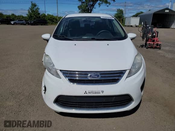 2011 Ford Fiesta SE z VIN 3FADP4BJ2BM239601, wystawiony jako Copart lot #70484235 z przebiegiem 145 671 mil mil oraz Szkoda całkowita • Salvage title. Historia ofert i sprzedaży dostępna na DreamBid. Obrazek 5.