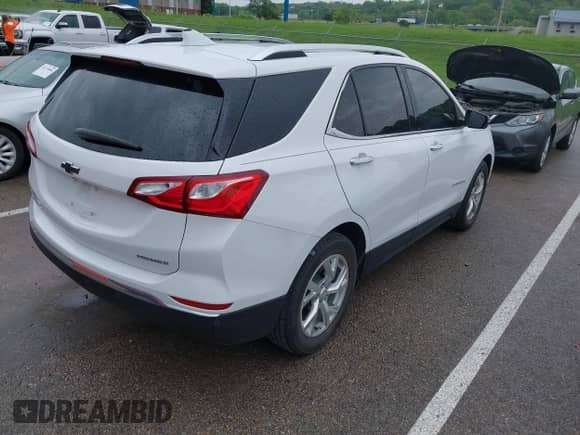 2021 Chevrolet Equinox Premier with VIN 3GNAXNEV5MS160043, listed as a IAAI auction lot 42109564 with 36,808 mi miles and . Bid and sale history available at DreamBid. Image 4.