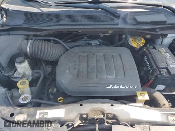 2018 Dodge Grand Caravan SE with VIN 2C7WDGBG2JR363038, listed as a Copart auction lot 57245325 with 185,611 mi miles and Clean title. Bid and sale history available at DreamBid. Image 12.