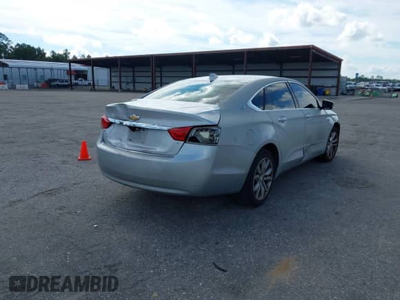 2018 Chevrolet Impala LT with VIN 2G1105S32J9111562, listed as a IAAI auction lot 43179096 with 165,492 mi miles and . Bid and sale history available at DreamBid. Image 4.
