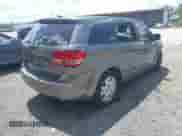 2013 Dodge Journey American Value z VIN 3C4PDCAB1DT710523, wystawiony jako IAAI lot #42997519 z przebiegiem 162 129 mil mil oraz . Historia ofert i sprzedaży dostępna na DreamBid. Obrazek 4.