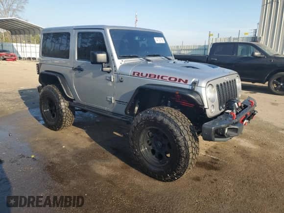 2016 Jeep Wrangler Rubicon with VIN 1C4BJWCG0GL170403, listed as a Copart auction lot 44132165 with 124,557 mi miles and Salvage title. Bid and sale history available at DreamBid. Image 4.
