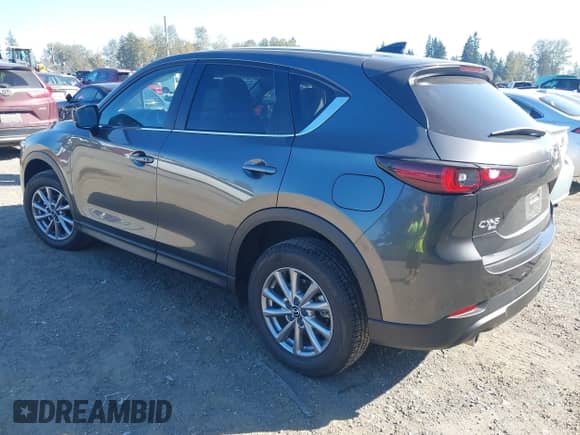 2023 Mazda CX-5 S Carbon Edition z VIN JM3KFBCM6P0143148, wystawiony jako IAAI lot #43382486 z przebiegiem 22 099 mil mil oraz . Historia ofert i sprzedaży dostępna na DreamBid. Obrazek 3.