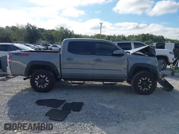 2021 Toyota Tacoma SR with VIN 3TYCZ5ANXMT024937, listed as a IAAI auction lot 43314888 with 77,580 mi miles and . Bid and sale history available at DreamBid. Image 13.