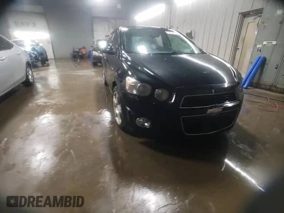 2014 Chevrolet Sonic LTZ with VIN 1G1JE6SB4E4113191, listed as a Copart auction lot 84648704 with 98,133 mi miles and Salvage title. Bid and sale history available at DreamBid. Image 13.