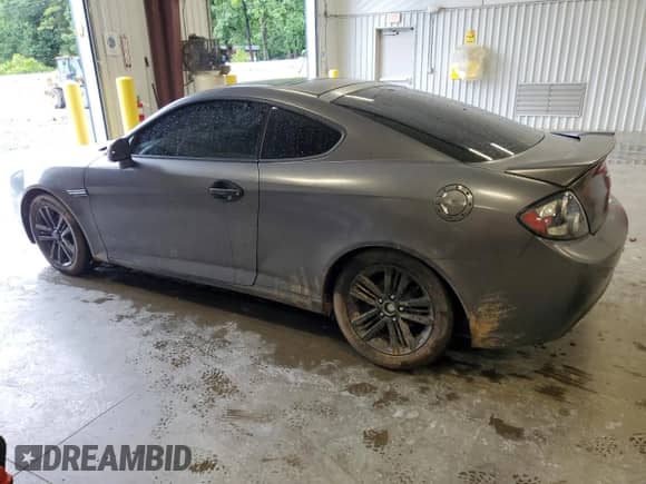2007 Hyundai Tiburon GS с VIN KMHHM66D57U261613, выставлен на аукционе Copart как лот 57821245 с пробегом 185 489 миль миль и Списание • Salvage title. История ставок и продаж доступна на DreamBid. Изображение 2.