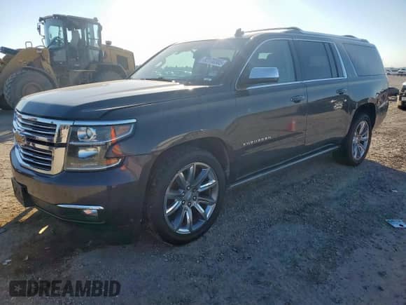 2015 Chevrolet Suburban LTZ with VIN 1GNSCKKC5FR303631, listed as a Copart auction lot 82170305 with 234,598 mi miles and Salvage title. Bid and sale history available at DreamBid. Image 1.