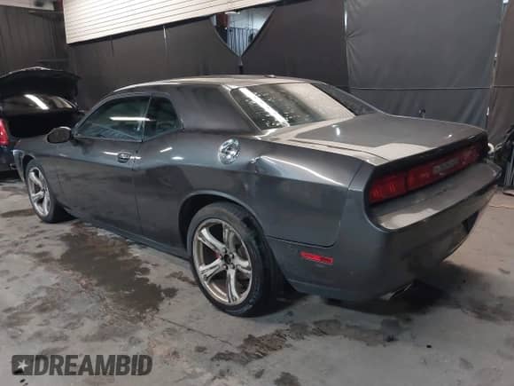 2013 Dodge Challenger SXT с VIN 2C3CDYAG5DH593050, выставлен на аукционе IAAI как лот 43392807 с пробегом 163 707 миль миль и . История ставок и продаж доступна на DreamBid. Изображение 3.