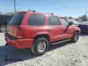 1999 Dodge Durango with VIN 1B4HS28Z1XF528727, listed as a Copart auction lot 77621824 with 164,880 mi miles and Salvage title. Bid and sale history available at DreamBid. Image 3.
