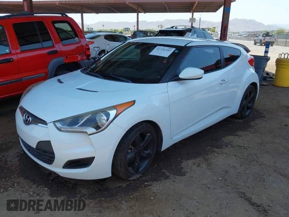 2014 Hyundai Veloster with VIN KMHTC6ADXEU209850, listed as a IAAI auction lot 42726384 with 128,523 mi miles and . Bid and sale history available at DreamBid. Image 2.
