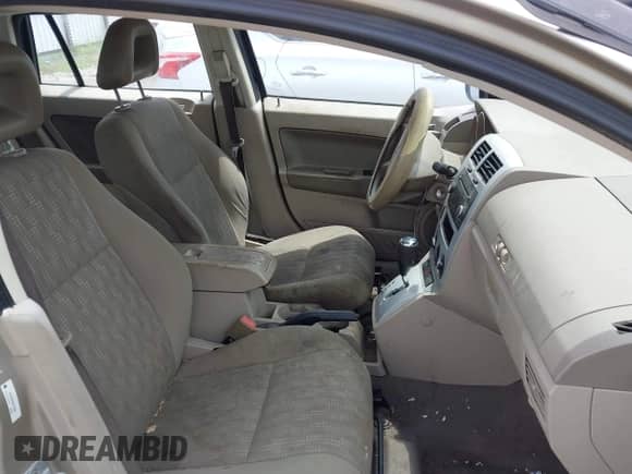 2009 Dodge Caliber SE with VIN 1B3HB28A49D152960, listed as a IAAI auction lot 42595261 with 168,166 mi miles and . Bid and sale history available at DreamBid. Image 5.