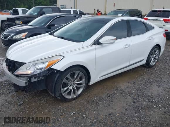 2016 Hyundai Azera Limited z VIN KMHFH4JG6GA507801, wystawiony jako IAAI lot #42292585 z przebiegiem 156 460 mil mil oraz . Historia ofert i sprzedaży dostępna na DreamBid. Obrazek 19.