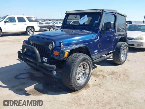 2004 Jeep Wrangler Sport z VIN 1J4FA49S04P753389, wystawiony jako IAAI lot #43408484 z przebiegiem 157 237 mil mil oraz . Historia ofert i sprzedaży dostępna na DreamBid. Obrazek 2.