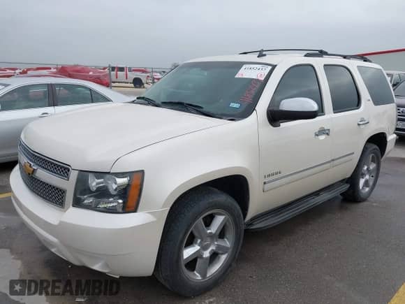 2012 Chevrolet Tahoe LTZ z VIN 1GNSCCE06CR305746, wystawiony jako IAAI lot #41852437 z przebiegiem 198 372 mil mil oraz . Historia ofert i sprzedaży dostępna na DreamBid. Obrazek 2.