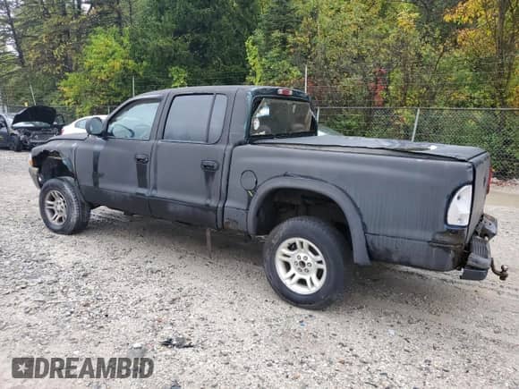 2000 Dodge Dakota Sport z VIN 1B7GG2AN0YS779786, wystawiony jako Copart lot #81118925 z przebiegiem 125 684 mil mil oraz Szkoda całkowita • Salvage title. Historia ofert i sprzedaży dostępna na DreamBid. Obrazek 2.