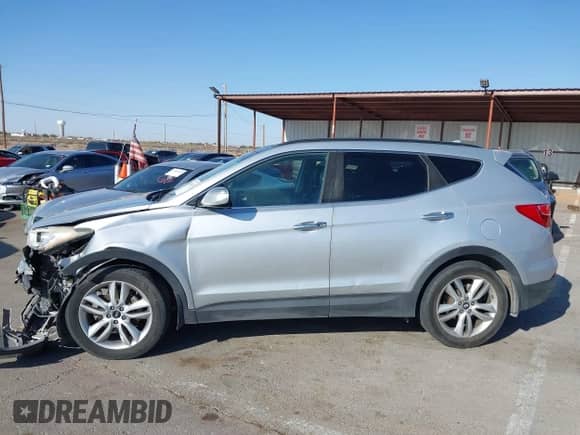 2015 Hyundai Santa Fe with VIN 5XYZWDLA8FG255743, listed as a IAAI auction lot 42014071 with 168,897 mi miles and . Bid and sale history available at DreamBid. Image 14.