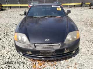 2003 Hyundai Tiburon GT с VIN KMHHN65F13U084620, выставлен на аукционе Copart как лот 46880185 с пробегом Не указан миль и На запчасти • Non repairable. История ставок и продаж доступна на DreamBid. Изображение 5.