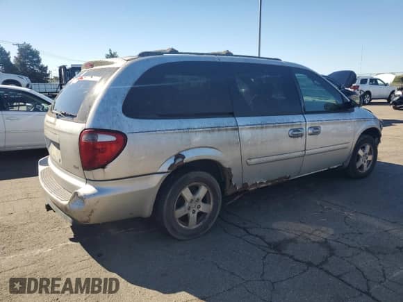 2005 Dodge Caravan SXT with VIN 2D4GP44L35R171752, listed as a Copart auction lot 87091335 with 205,386 mi miles and Salvage title. Bid and sale history available at DreamBid. Image 3.
