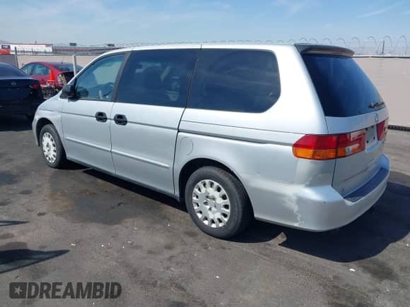 2004 Honda Odyssey LX with VIN 5FNRL18524B063998, listed as a IAAI auction lot 43022221 with 174,551 mi miles and . Bid and sale history available at DreamBid. Image 3.