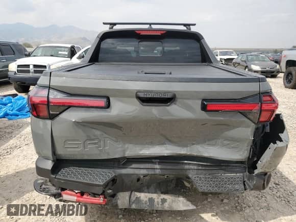 2022 Hyundai Santa Cruz SEL с VIN 5NTJC4AE0NH032374, выставлен на аукционе Copart как лот 71115415 с пробегом 30 044 миль миль и Списание • Salvage title. История ставок и продаж доступна на DreamBid. Изображение 6.
