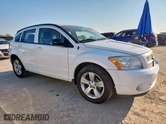 2011 Dodge Caliber Mainstreet z VIN 1B3CB3HA6BD254136, wystawiony jako Copart lot #82222795 z przebiegiem 101 121 mil mil oraz Czysty tytuł • Clean title. Historia ofert i sprzedaży dostępna na DreamBid. Obrazek 4.