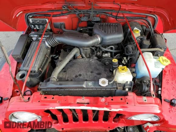 2000 Jeep Wrangler SE with VIN 1J4FA29P8YP711686, listed as a Copart auction lot 68999455 with 100,108 mi miles and Salvage title. Bid and sale history available at DreamBid. Image 12.