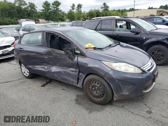 2012 Ford Fiesta SE with VIN 3FADP4BJ9CM181861, listed as a Copart auction lot 68965845 with 87,327 mi miles and Salvage title. Bid and sale history available at DreamBid. Image 4.