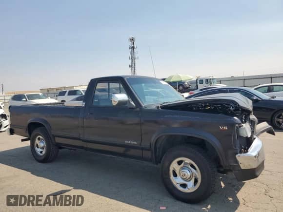 1995 Dodge Dakota S с VIN 1B7GL26X1SS201015, выставлен на аукционе Copart как лот 71497875 с пробегом 174 758 миль миль и Списание • Salvage title. История ставок и продаж доступна на DreamBid. Изображение 4.
