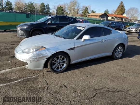 2007 Hyundai Tiburon GS with VIN KMHHM66DX7U246220, listed as a Copart auction lot 53555715 with 105,305 mi miles and Salvage title. Bid and sale history available at DreamBid. Image 1.