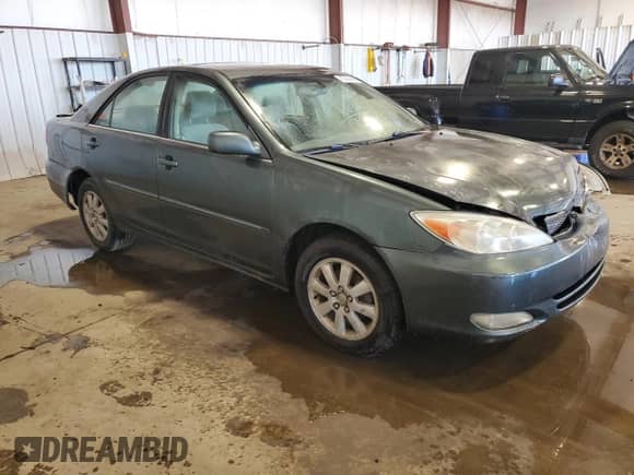 2003 Toyota Camry XLE с VIN 4T1BE30K43U704577, выставлен на аукционе Copart как лот 87444445 с пробегом 205 977 миль миль и Списание • Salvage title. История ставок и продаж доступна на DreamBid. Изображение 4.