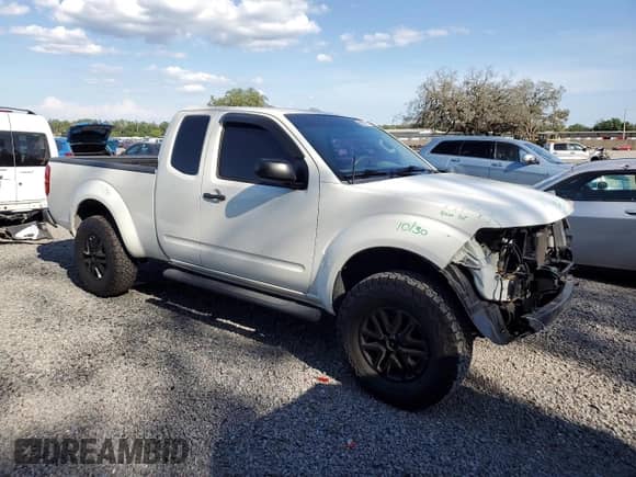 2015 Nissan Frontier SV with VIN 1N6AD0CW7FN760136, listed as a Copart auction lot 58114785 with 115,401 mi miles and Salvage title. Bid and sale history available at DreamBid. Image 4.